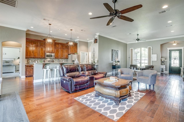 9001 Magnolia Vale Dr, Granbury, TX 76049 - living area featuring arched walkways, ceiling fan, light wood-style flooring, recessed lighting, and baseboards