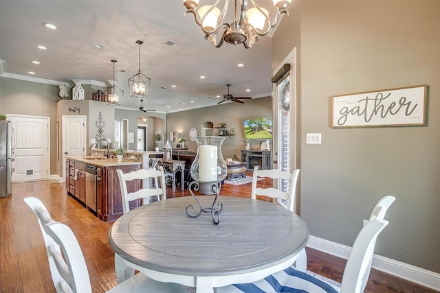 9001 Magnolia Vale Dr, Granbury, TX 76049 - dining area with a ceiling fan, crown molding, recessed lighting, a chandelier, and baseboards