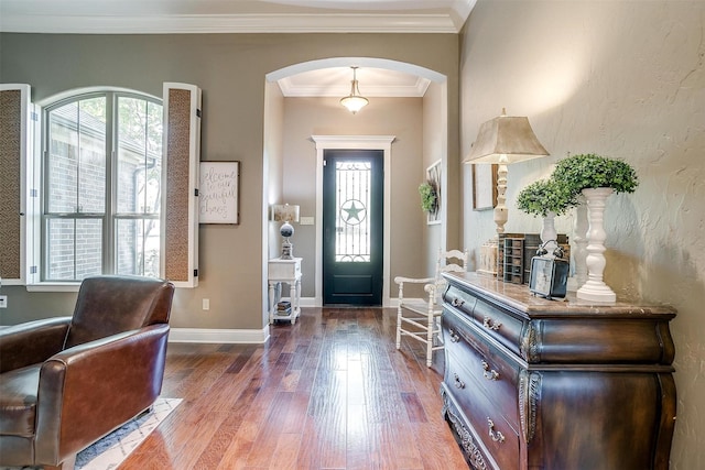 9001 Magnolia Vale Dr, Granbury, TX 76049 - entrance foyer with arched walkways, wood finished floors, crown molding, and baseboards