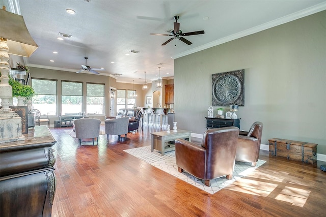 9001 Magnolia Vale Dr, Granbury, TX 76049 - living area featuring a ceiling fan, ornamental molding, light wood-style flooring, recessed lighting, and baseboards
