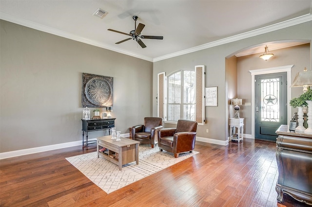 9001 Magnolia Vale Dr, Granbury, TX 76049 - living area featuring arched walkways, a ceiling fan, hardwood / wood-style flooring, ornamental molding, and baseboards
