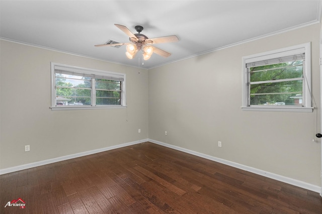 empty room with dark wood-type flooring, ceiling fan, baseboards, and crown molding