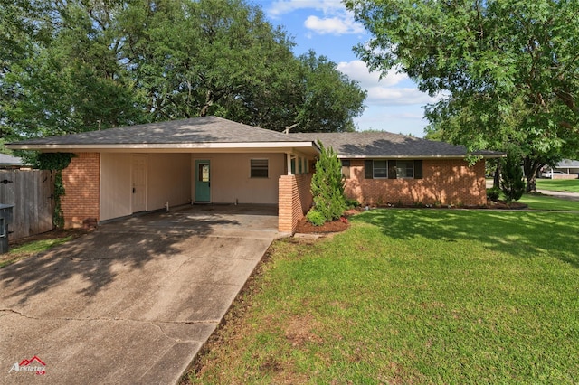 single story home featuring brick siding, concrete driveway, and a carport