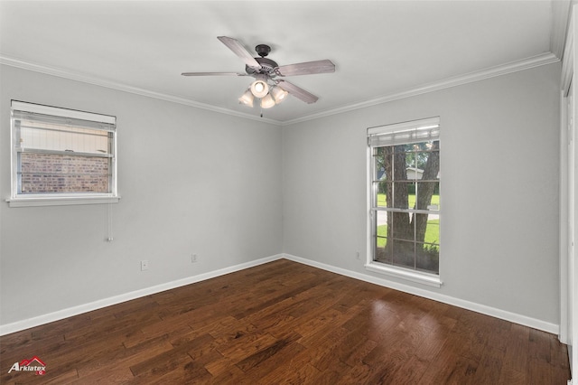 spare room with crown molding, baseboards, dark wood finished floors, and ceiling fan