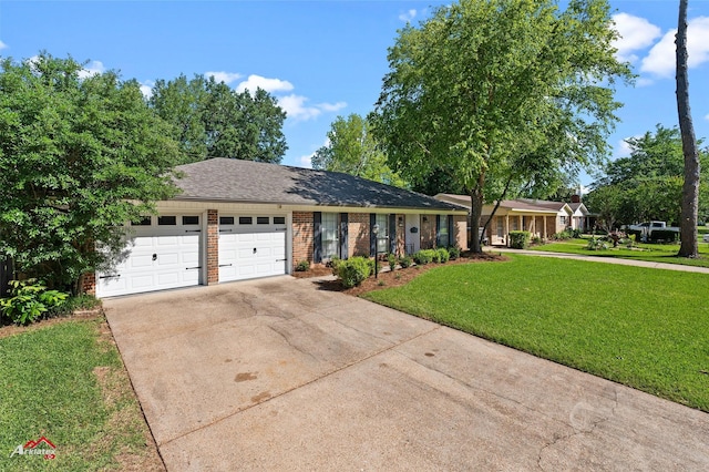 single story home with driveway, an attached garage, a front lawn, and brick siding