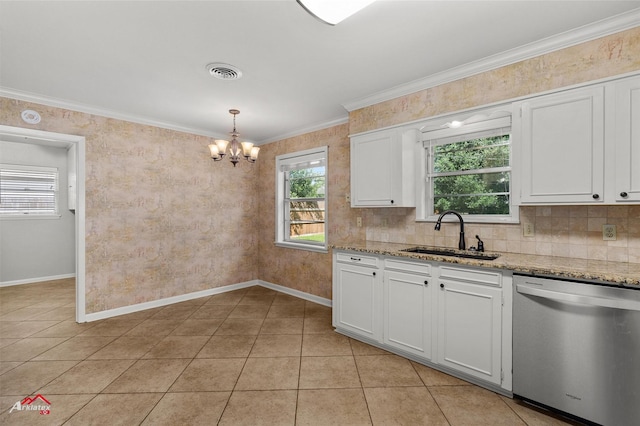 kitchen with dishwasher, a sink, a chandelier, plenty of natural light, and ornamental molding