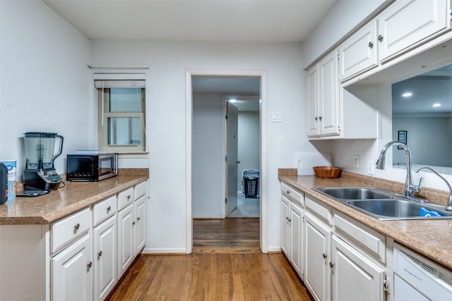 2902 Hillglenn Rd, Dallas, TX 75228 - kitchen with a sink, light wood finished floors, white cabinetry, white dishwasher, and light countertops