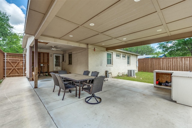 2902 Hillglenn Rd, Dallas, TX 75228 - view of patio with a fenced backyard, outdoor dining area, central air condition unit, and a gate