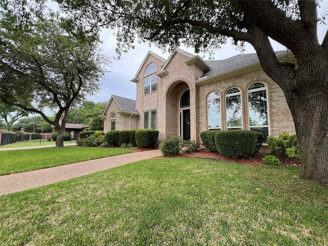 5603 S Archbridge Ct, Arlington, TX 76017 - view of front facade with brick siding and roof with shingles