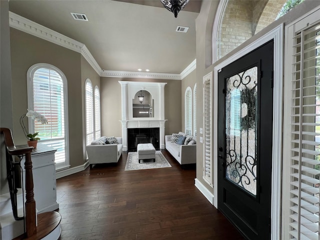 5603 S Archbridge Ct, Arlington, TX 76017 - entryway with dark wood finished floors, a fireplace, ornamental molding, and baseboards