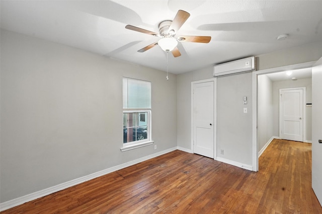 4808 Birchman Ave, Fort Worth, TX 76107 - empty room with a wall mounted AC, wood finished floors, baseboards, and a ceiling fan