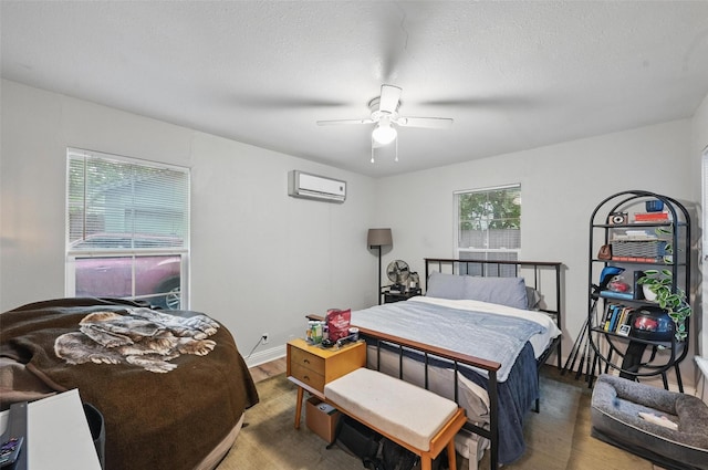4808 Birchman Ave, Fort Worth, TX 76107 - bedroom featuring wood finished floors, an AC wall unit, and ceiling fan