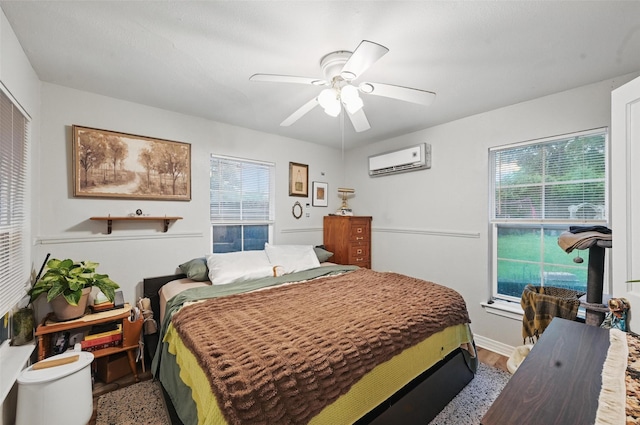 4808 Birchman Ave, Fort Worth, TX 76107 - bedroom with an AC wall unit, a ceiling fan, and light wood-type flooring