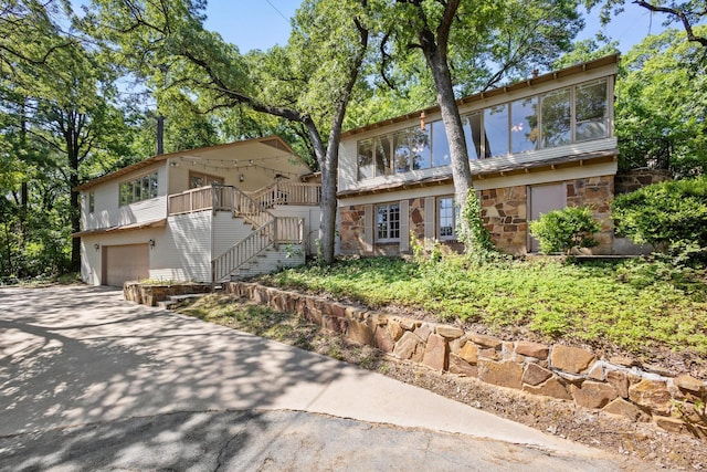 219 Ray Rd, Pottsboro, TX 75076 - view of front of home featuring stone siding, stairway, a garage, and driveway