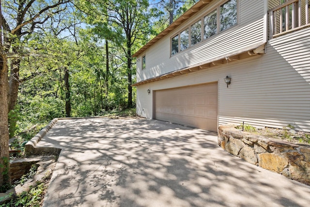219 Ray Rd, Pottsboro, TX 75076 - view of side of property with an attached garage and driveway