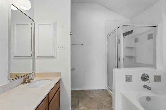 521 Bent Creek Dr, Garland, TX 75040 - full bath featuring a stall shower, lofted ceiling, vanity, a garden tub, and baseboards