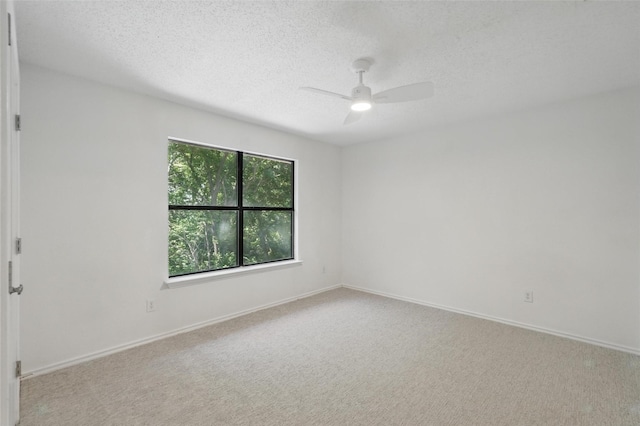 521 Bent Creek Dr, Garland, TX 75040 - empty room with a ceiling fan, a textured ceiling, carpet, and baseboards