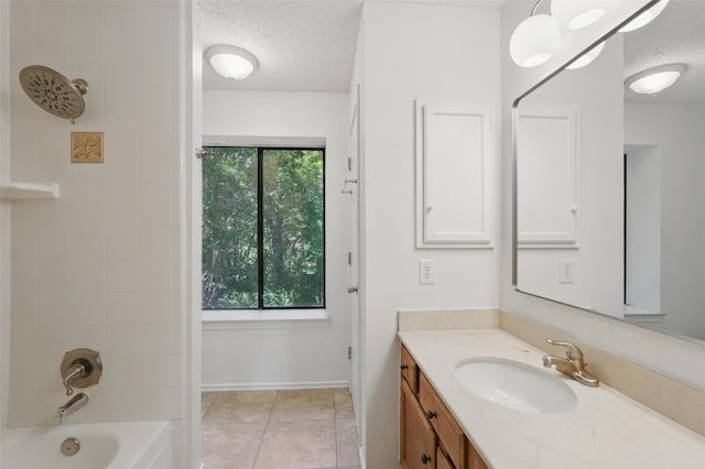 521 Bent Creek Dr, Garland, TX 75040 - full bath featuring a textured ceiling, vanity, tile patterned floors, shower / tub combination, and baseboards