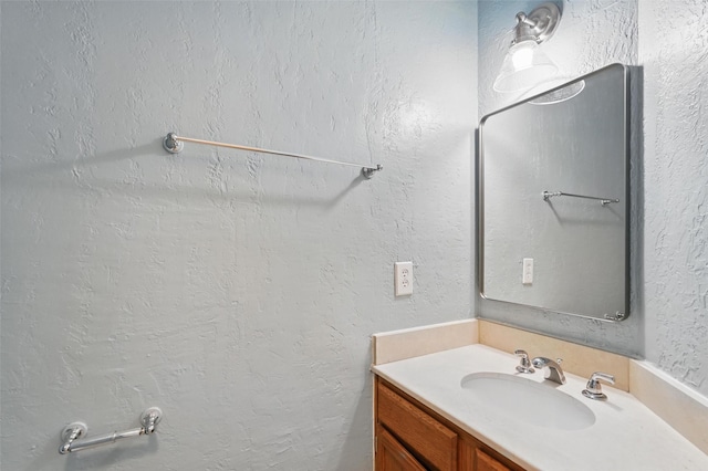 521 Bent Creek Dr, Garland, TX 75040 - bathroom featuring vanity and a textured wall