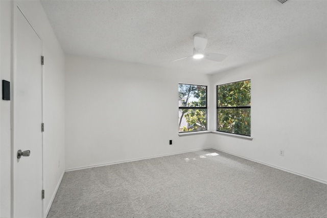 521 Bent Creek Dr, Garland, TX 75040 - carpeted spare room featuring a ceiling fan, a textured ceiling, and baseboards