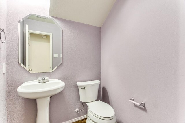 7500 Lazy Spur Blvd, Fort Worth, TX 76131 - half bathroom featuring toilet and a sink