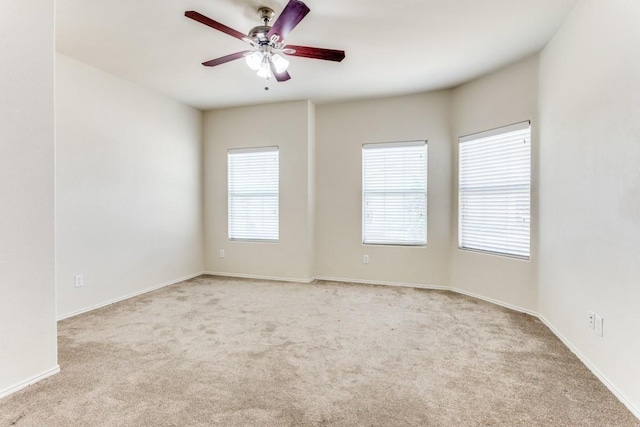 7500 Lazy Spur Blvd, Fort Worth, TX 76131 - empty room featuring light carpet, a ceiling fan, and baseboards