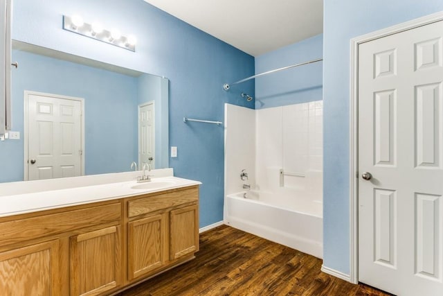 7500 Lazy Spur Blvd, Fort Worth, TX 76131 - bathroom featuring wood finished floors, bathtub / shower combination, vanity, and baseboards