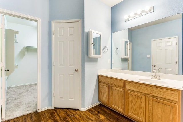 7500 Lazy Spur Blvd, Fort Worth, TX 76131 - bathroom with wood finished floors, vanity, and baseboards