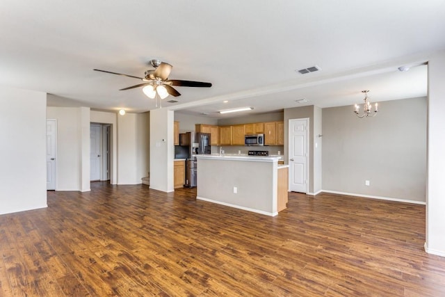 7500 Lazy Spur Blvd, Fort Worth, TX 76131 - unfurnished living room with a chandelier, dark wood-style flooring, ceiling fan, and baseboards