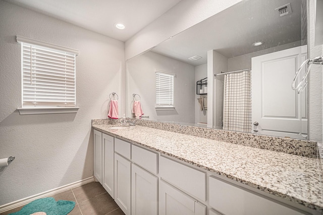 6505 Boot Jack Dr, Burleson, TX 76058 - bathroom with tile patterned floors, curtained shower, vanity, and baseboards