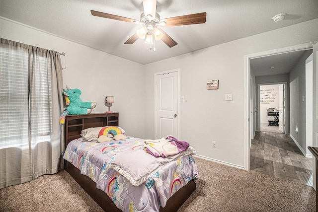 6505 Boot Jack Dr, Burleson, TX 76058 - carpeted bedroom with baseboards and a ceiling fan