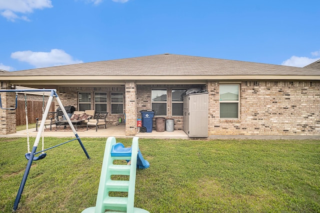 6505 Boot Jack Dr, Burleson, TX 76058 - back of property featuring brick siding, a patio, and roof with shingles