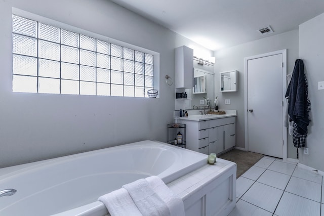 2801 Peachtree Ln, Pantego, TX 76013 - full bathroom featuring a bath, vanity, and tile patterned flooring
