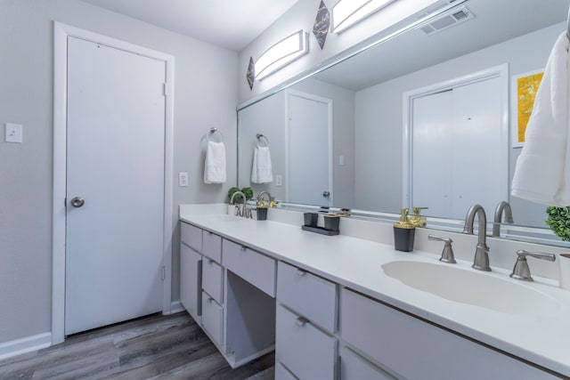 2801 Peachtree Ln, Pantego, TX 76013 - full bath with wood finished floors and double vanity