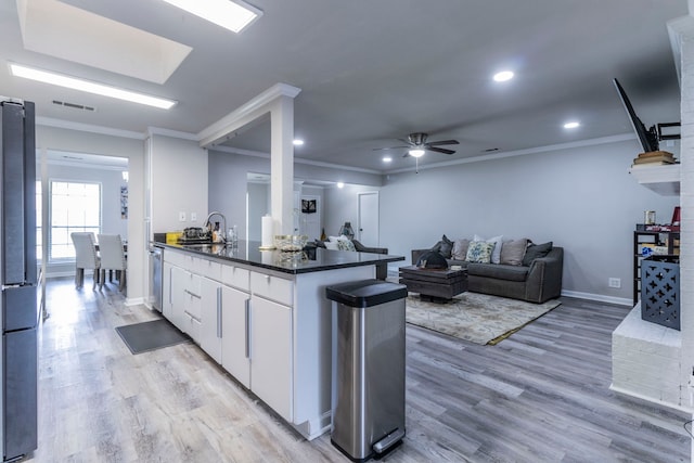 2801 Peachtree Ln, Pantego, TX 76013 - kitchen featuring freestanding refrigerator, a sink, dark countertops, crown molding, and ceiling fan