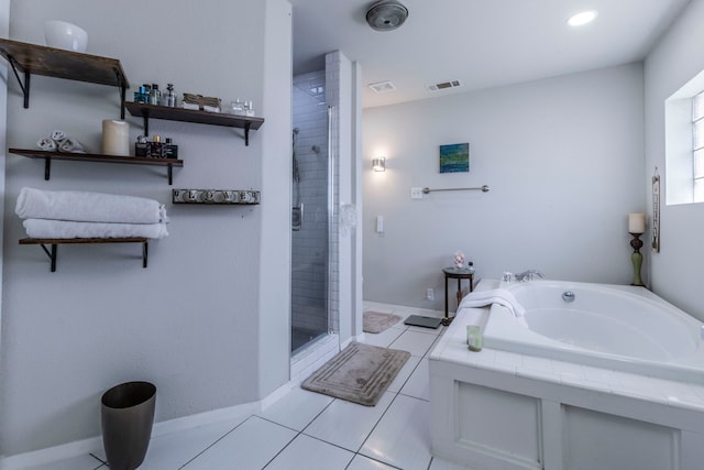 2801 Peachtree Ln, Pantego, TX 76013 - full bath with a shower stall, a garden tub, tile patterned floors, and baseboards