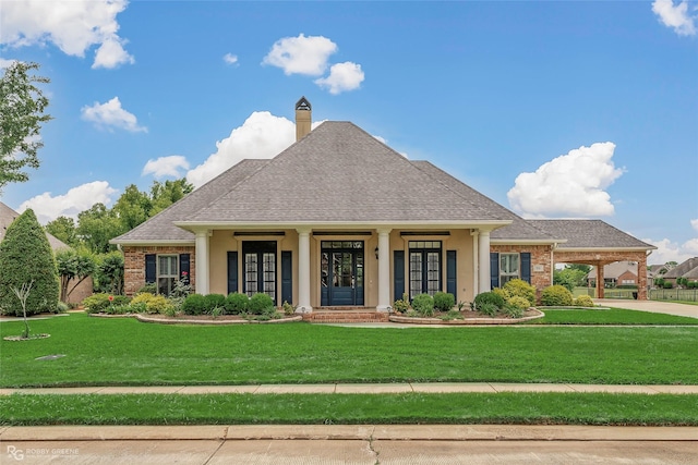 532 Hunters Run, Bossier City, LA 71111 - view of front facade with a front lawn, a chimney, roof with shingles, brick siding, and stucco siding