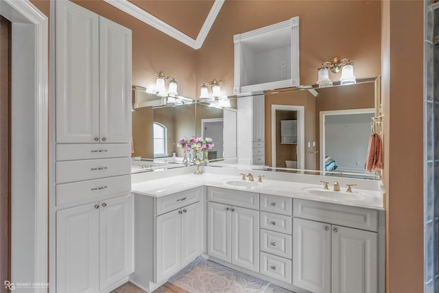 532 Hunters Run, Bossier City, LA 71111 - bathroom with crown molding, double vanity, tile patterned floors, and lofted ceiling