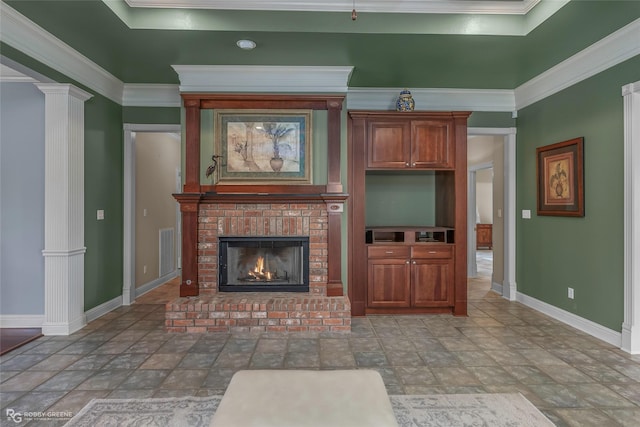 532 Hunters Run, Bossier City, LA 71111 - living area featuring stone finish floors, baseboards, ornamental molding, a brick fireplace, and ornate columns