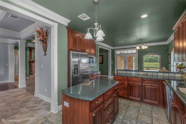 532 Hunters Run, Bossier City, LA 71111 - kitchen featuring appliances with stainless steel finishes, a chandelier, stone finish floors, decorative columns, and ornamental molding