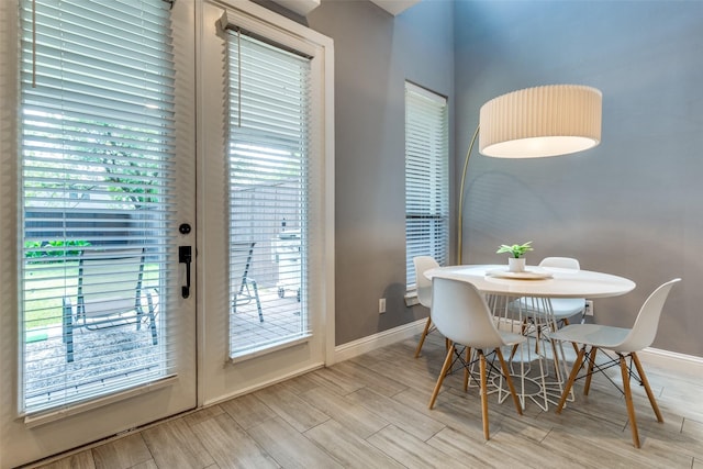 5006 Mission Ave, Dallas, TX 75206 - dining space with baseboards, wood finished floors, and healthy amount of natural light