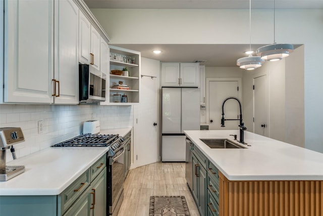 5006 Mission Ave, Dallas, TX 75206 - kitchen with stainless steel appliances, a sink, open shelves, backsplash, and light wood-style flooring