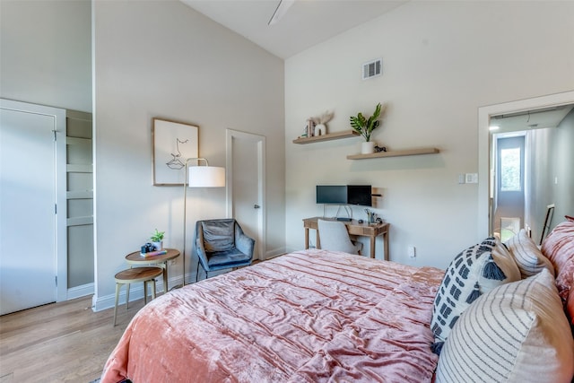 5006 Mission Ave, Dallas, TX 75206 - bedroom featuring high vaulted ceiling, wood finished floors, and baseboards
