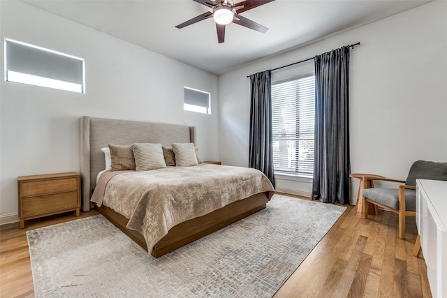 5006 Mission Ave, Dallas, TX 75206 - bedroom with light wood-style floors, ceiling fan, and baseboards