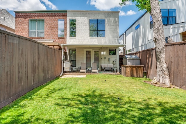 5006 Mission Ave, Dallas, TX 75206 - rear view of property featuring brick siding, a storage shed, outdoor lounge area, an outdoor structure, and a patio area