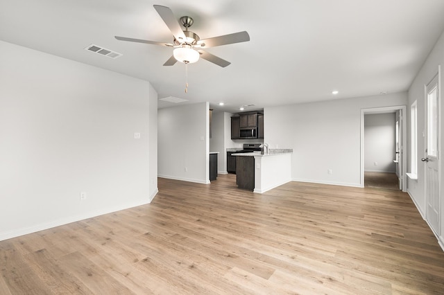 432 Gib Woodall Dr, Venus, TX 76084 - unfurnished living room featuring a ceiling fan, light wood finished floors, baseboards, and recessed lighting