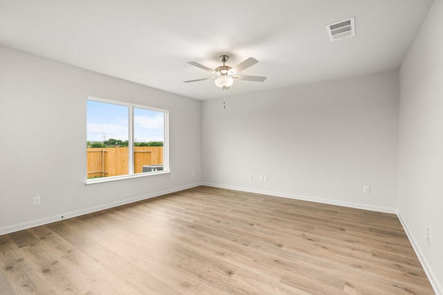 432 Gib Woodall Dr, Venus, TX 76084 - spare room featuring a ceiling fan, light wood-type flooring, and baseboards