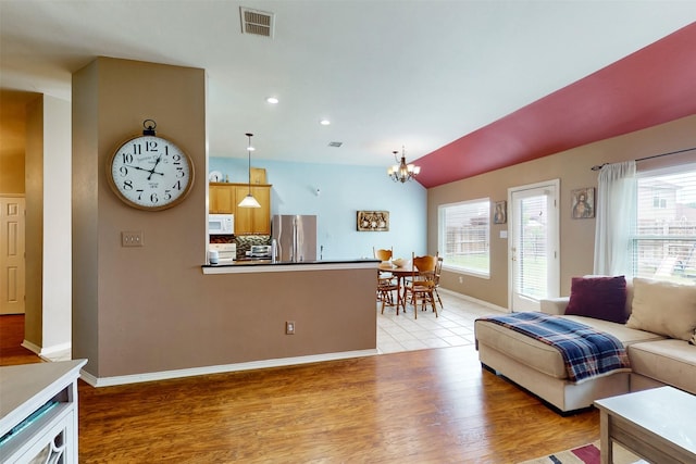 203 Millington Trl, Mansfield, TX 76063 - living room with a chandelier, light wood-style flooring, baseboards, recessed lighting, and vaulted ceiling