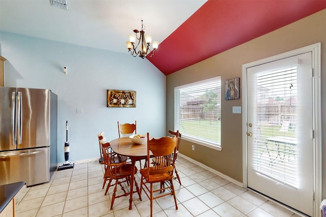 203 Millington Trl, Mansfield, TX 76063 - dining space with vaulted ceiling, a chandelier, light tile patterned floors, and baseboards