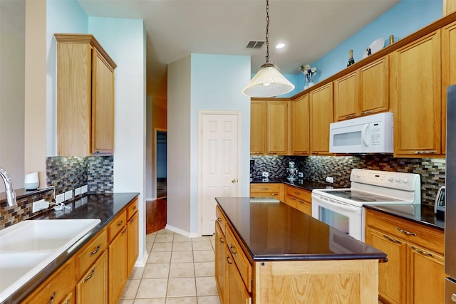 203 Millington Trl, Mansfield, TX 76063 - kitchen featuring white appliances, a sink, dark countertops, and a kitchen island